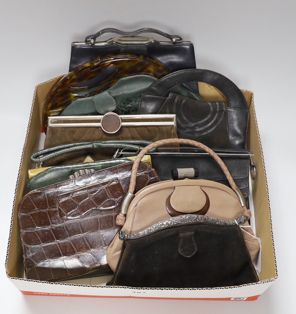 A collection of nine 1930's and 1940's leather, suede and crocodile ladies handbags with unusual metal clasps and frames